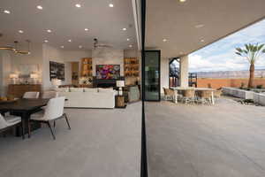 Dining space featuring a mountain view, recessed lighting, ceiling fan, and a tiled fireplace