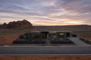 Contemporary house featuring concrete driveway and a mountain view