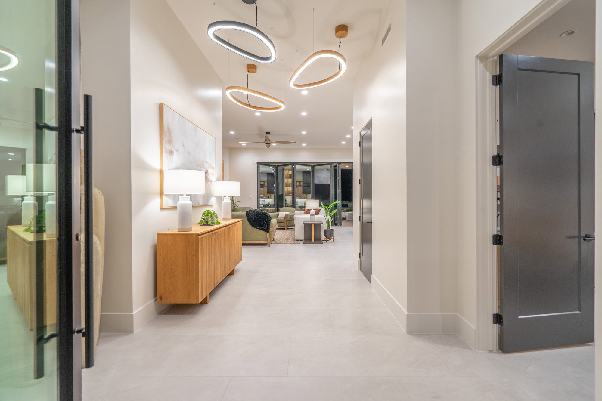 Hallway featuring recessed lighting and a high ceiling