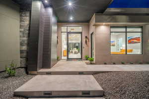 Entrance to property featuring stucco siding