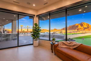 Sunroom featuring an area to practice putting