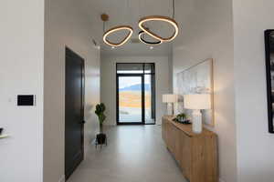 Foyer entrance featuring baseboards and a high ceiling
