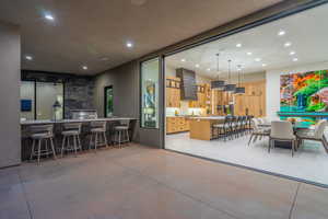 Dining area featuring recessed lighting and finished concrete floors