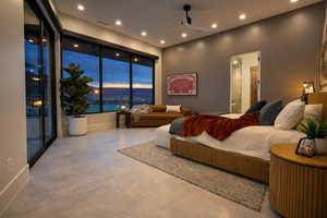 Bedroom with access to exterior, ceiling fan, recessed lighting, and ensuite bath