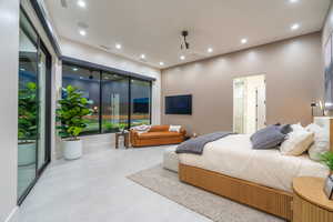 Bedroom with access to exterior, ceiling fan, and recessed lighting