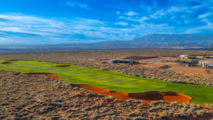 Drone / aerial view of mountains and a local golf course