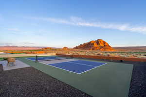 View of tennis court with a mountain view