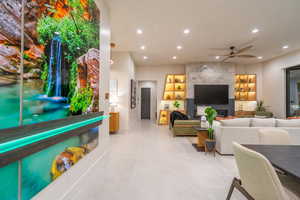 Living area with recessed lighting and ceiling fan