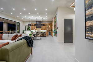 Living area featuring recessed lighting and beverage cooler