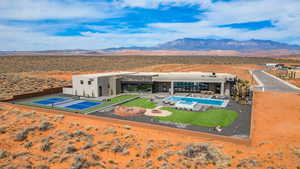 View from above of property featuring a pool and a mountainous background