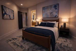 Bedroom featuring connected bathroom and recessed lighting