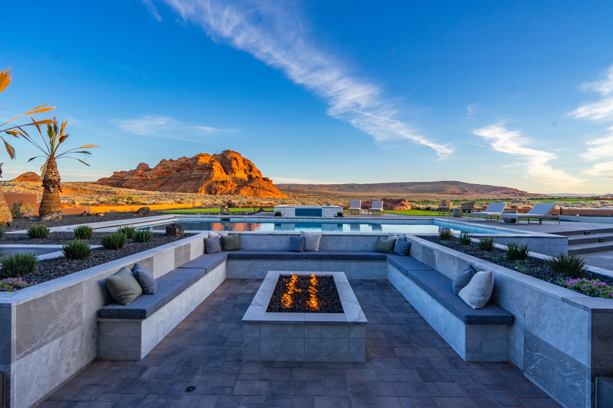 View of patio featuring an outdoor fire pit and a mountain view