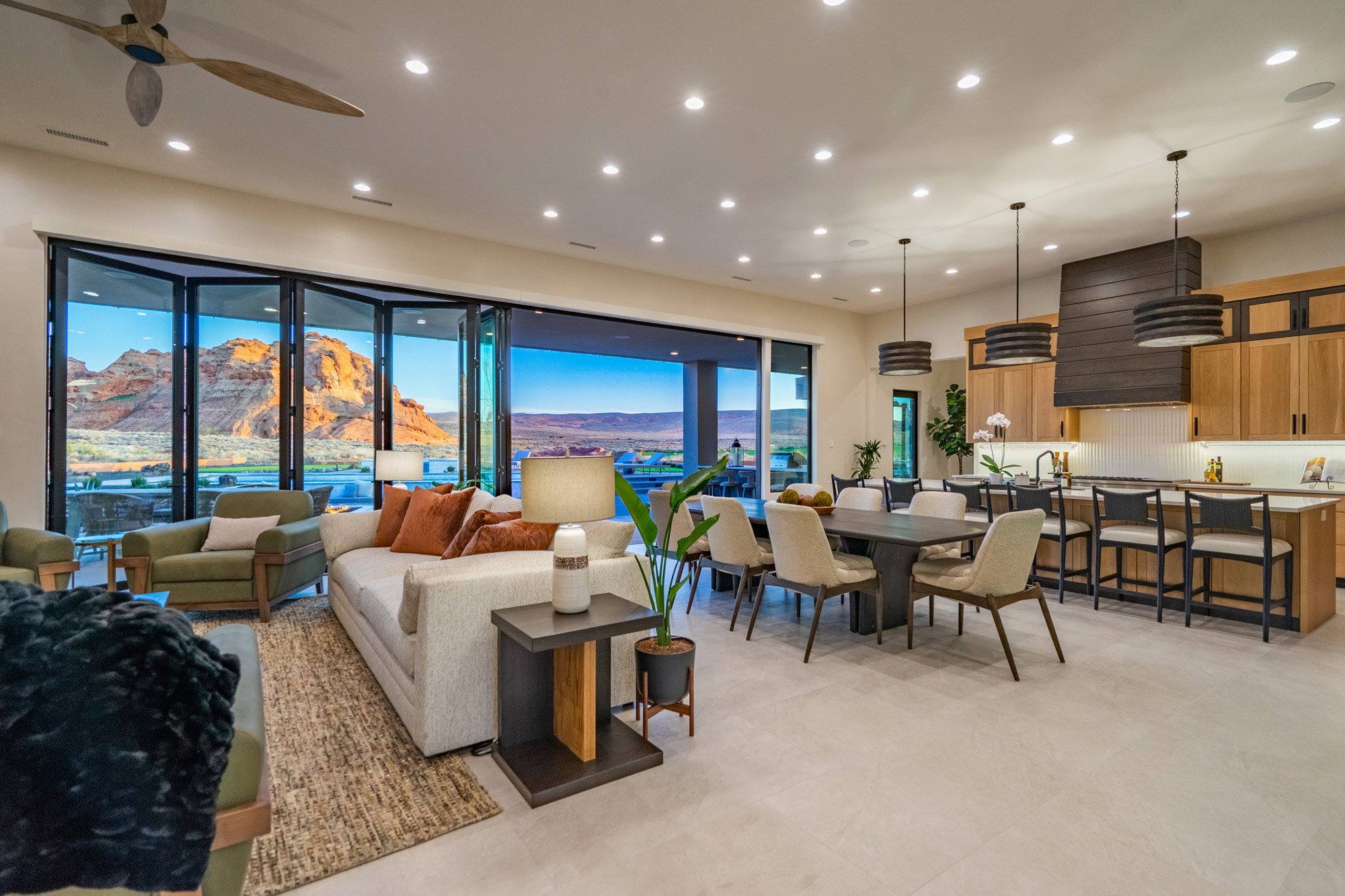 Living room with a mountain view, recessed lighting, and ceiling fan