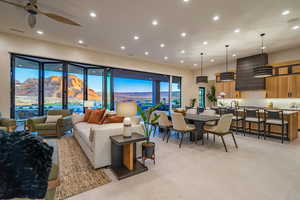 Living room with a mountain view, recessed lighting, and ceiling fan