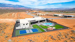 Aerial view of a mountain backdrop and a pool