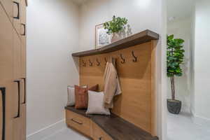 Mudroom featuring baseboards