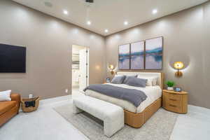 Bedroom with recessed lighting, ensuite bath, and ceiling fan