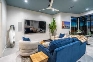Living room with recessed lighting and ceiling fan