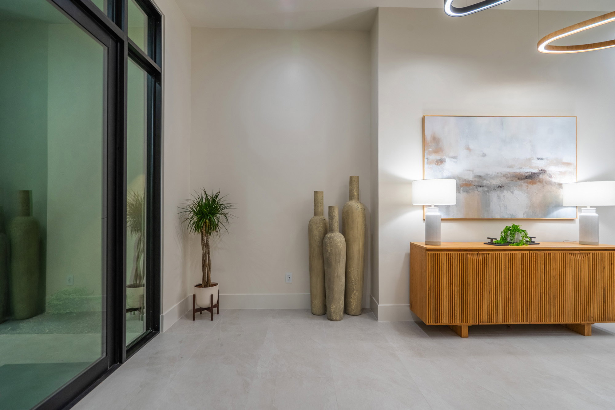 Sitting room featuring baseboards and concrete floors