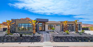 Modern home featuring stucco siding and a mountain view