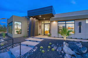 View of front of house with stucco siding