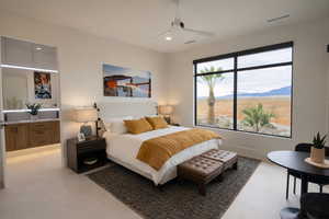 Bedroom with a mountain view, ceiling fan, and recessed lighting