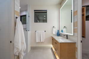 Full bath featuring vanity and recessed lighting