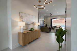 Hallway with recessed lighting and concrete floors
