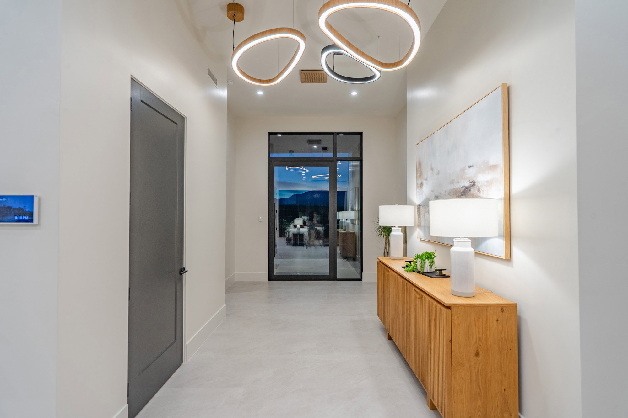 Hallway featuring concrete floors and baseboards
