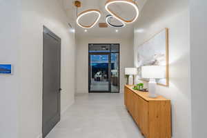 Hallway featuring concrete floors and baseboards
