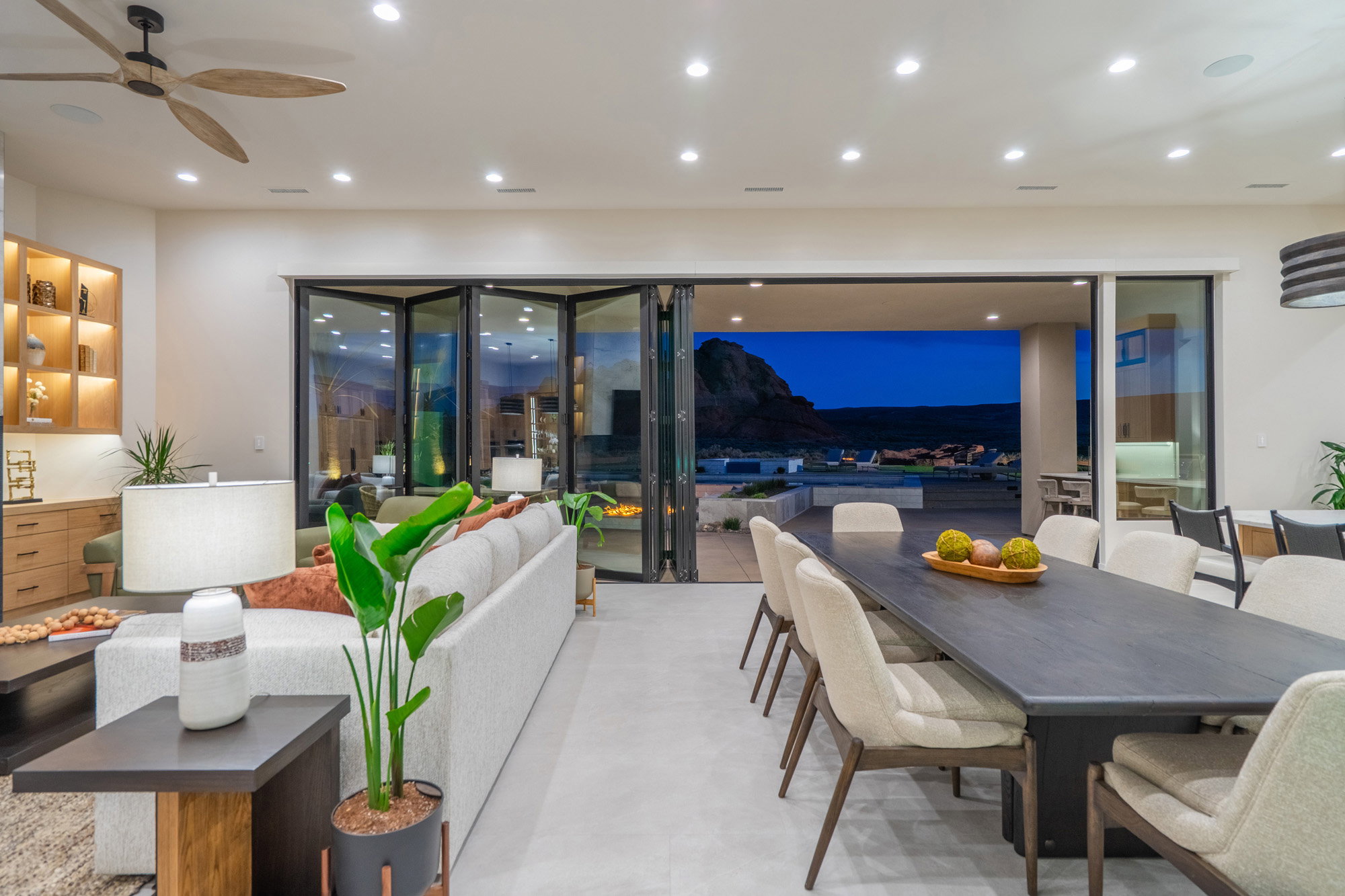 Living area with a ceiling fan and recessed lighting