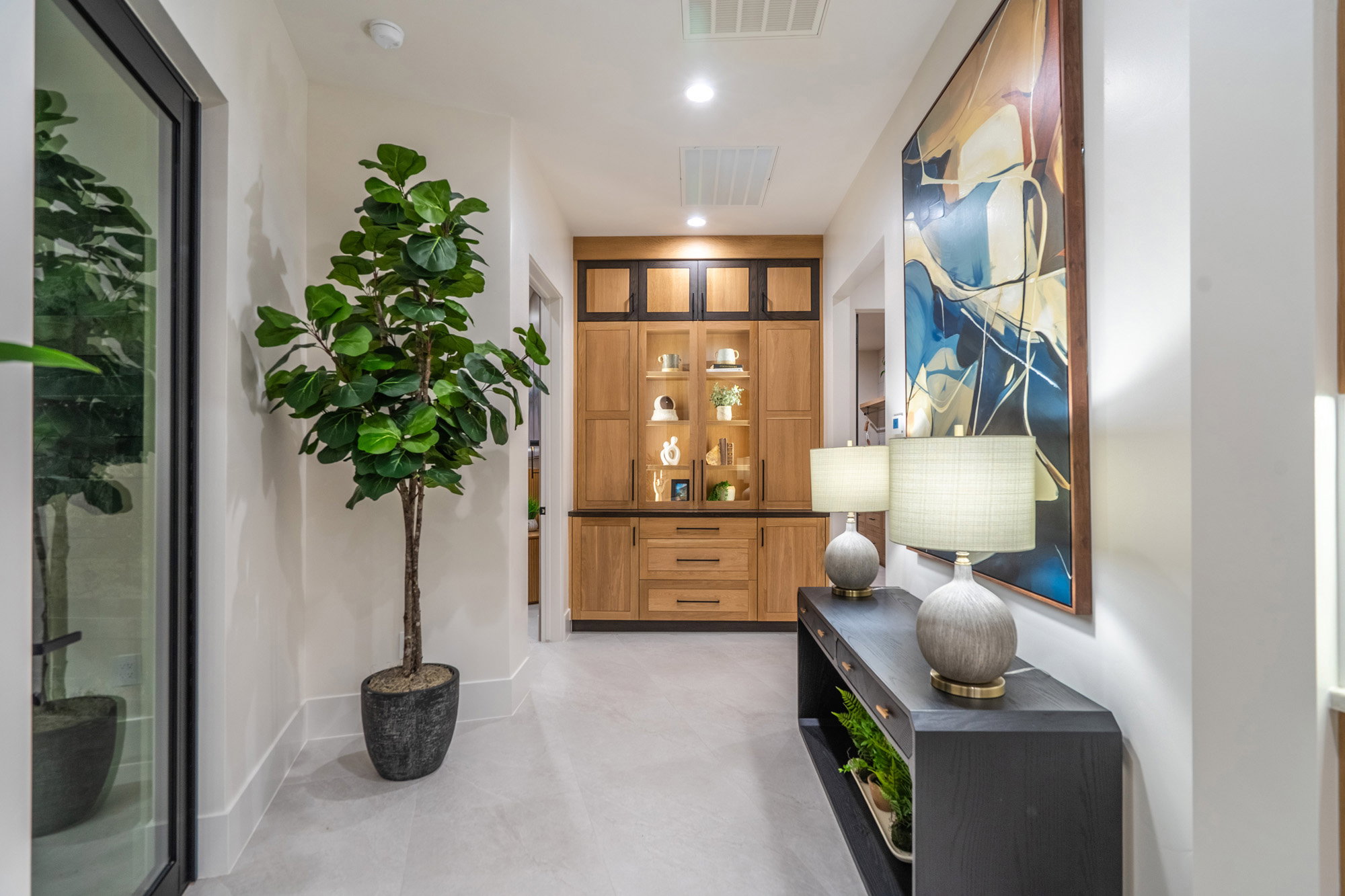 Hallway with recessed lighting and baseboards