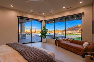 Bedroom featuring access to outside, recessed lighting, and a mountain view