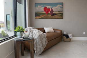 Sitting room featuring plenty of natural light