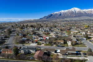 Aerial perspective of suburban area featuring a mountainous background