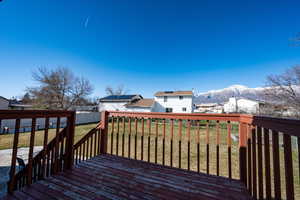 Deck featuring a mountain view and a residential view