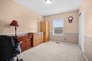 Office with light carpet and baseboards