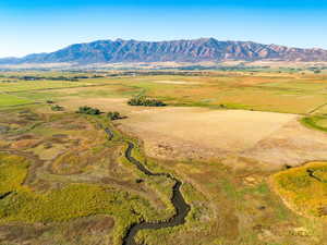View of mountain background featuring rural landscape