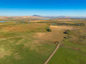 Overview of rural landscape featuring a mountain backdrop