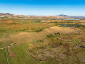 Overview of rural landscape featuring a water and mountain view