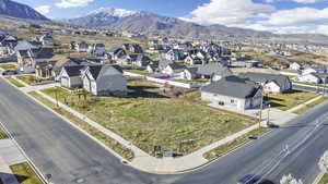 Aerial perspective of suburban area featuring a mountain backdrop