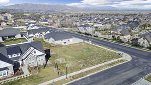 Aerial perspective of suburban area featuring a mountain backdrop
