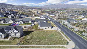 Aerial perspective of suburban area with a mountain backdrop