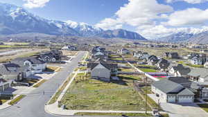 Aerial view of residential area featuring a mountainous background