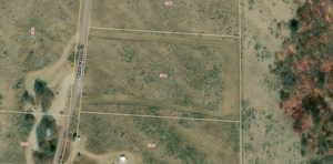 Aerial map of property and surrounding area with property parcel outlined