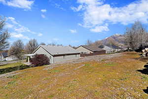 View of home's exterior with a residential view and a mountain view