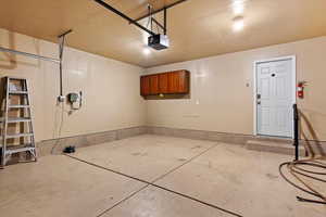 Garage featuring a garage door opener