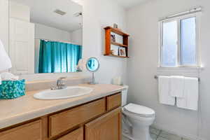 Full bathroom featuring vanity and a shower with shower curtain