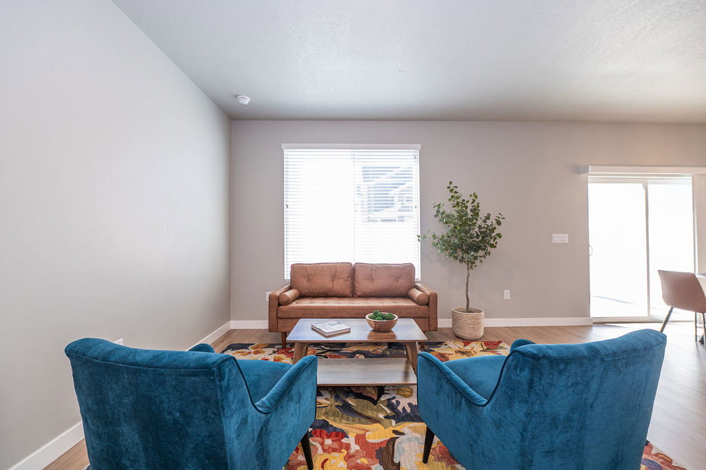 Living room featuring baseboards and wood finished floors