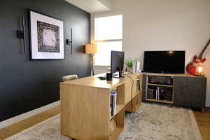 Office area featuring light wood-style flooring